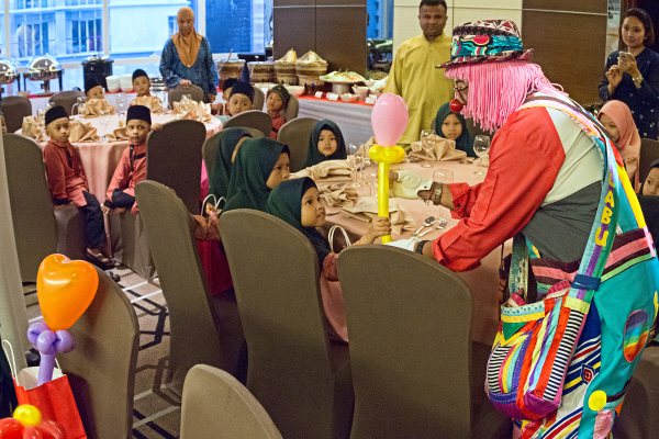 Ramada Suites KL extend hand of generosity during festive season Friendly clown